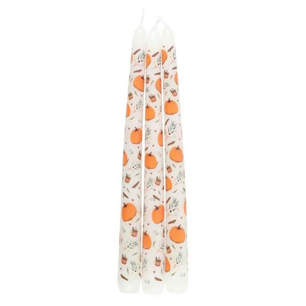Three white taper candles with orange pumpkins and autumn foliage print
