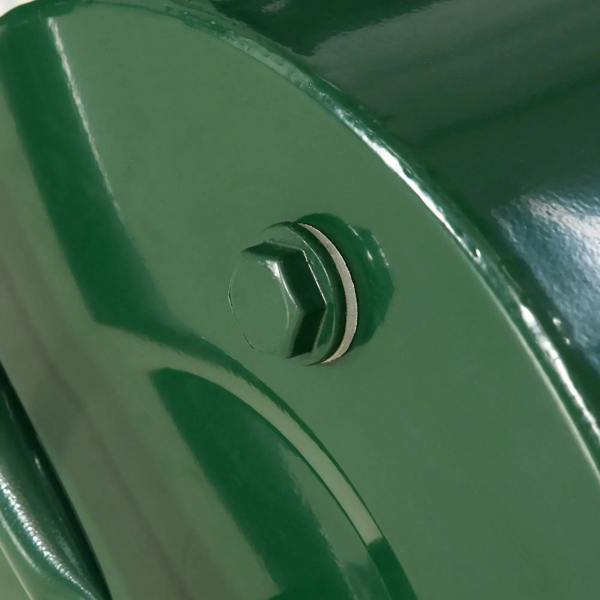 Close-up of green drain plug on metal lawn roller cylinder