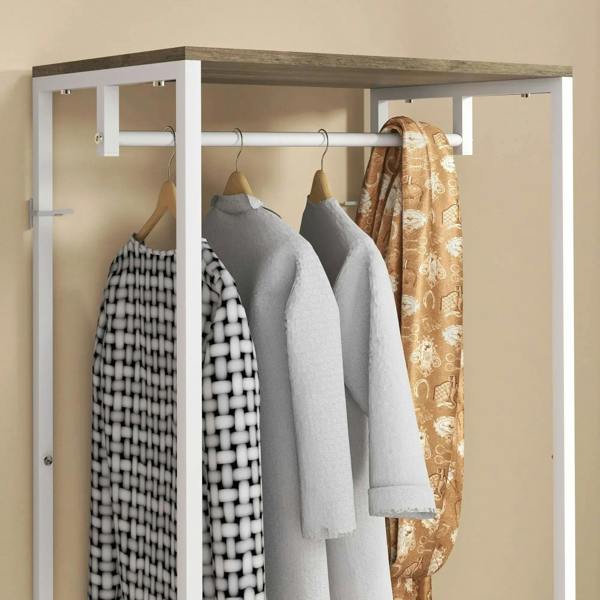 White coat rack frame with upper hanging bar and multiple garment hangers