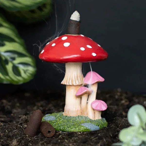 Mushroom backflow incense burner with red polka-dot cap, incense stick, pink side mushrooms