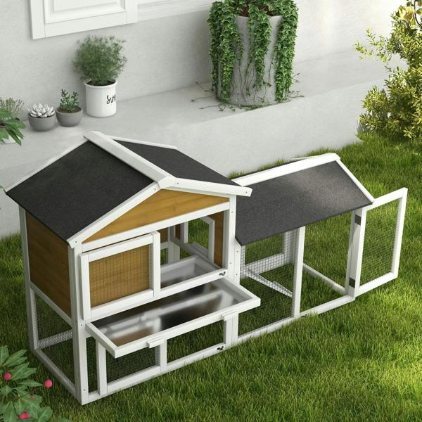 Yellow outdoor double rabbit hutch with two ramps and dark roof, front access