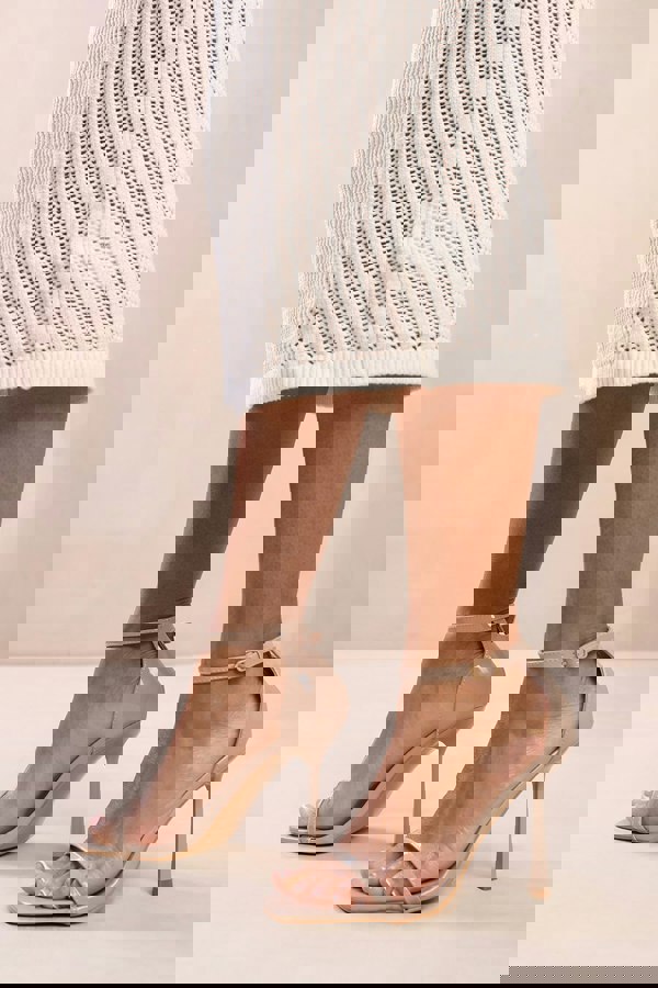 Where's That From Mila Strappy Stiletto Heel Sandal With Ankle Starp Closure in Nude Pu