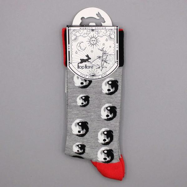 Gray bamboo sock with panda faces and red toe, laid flat
