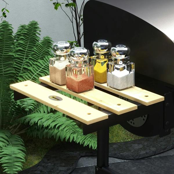 Black BBQ grill with wooden side shelf holding glass condiment jars