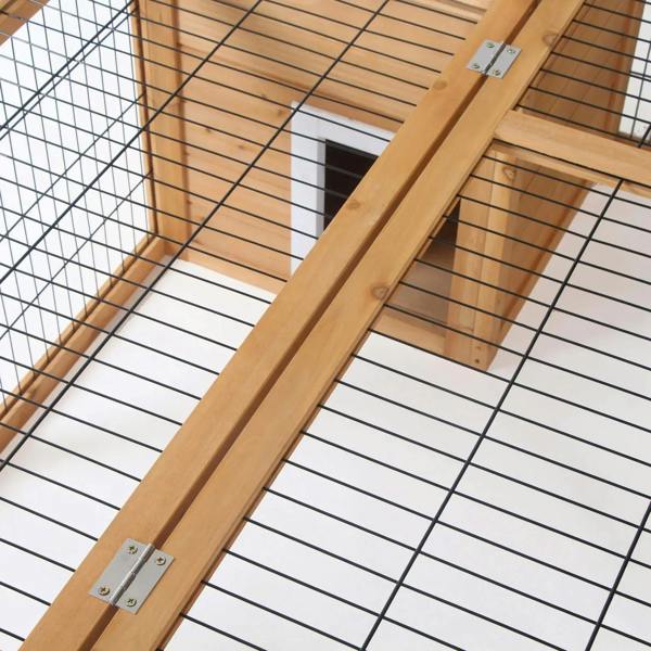 Metal hinge hardware on wooden roof beam for a rabbit hutch run cage