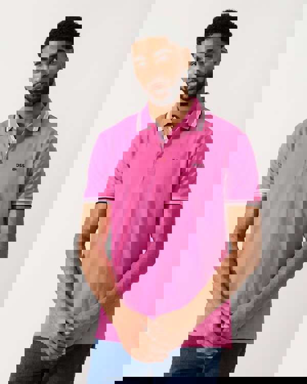 model wearing a BOSS Green Paddy Mens Cotton-Piqué Polo Shirt with Contrast Logo in Bright Pink