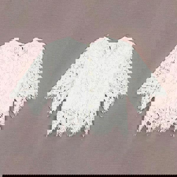 White lace top on a brown background