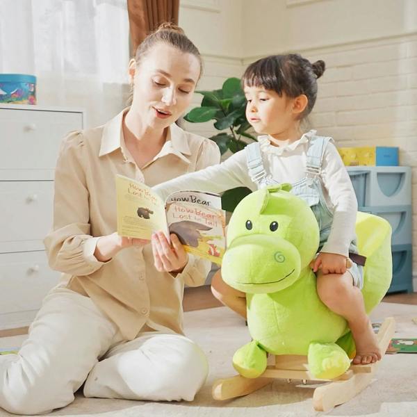 Green plush dinosaur ride-on rocking horse with plush head and wooden rocker base