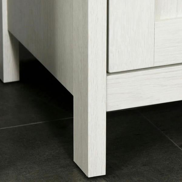 Antique white freestanding cabinet with slim legs and open clearance at the base
