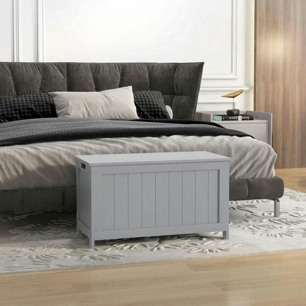 Grey wooden storage chest with closed lid and vertical paneled front