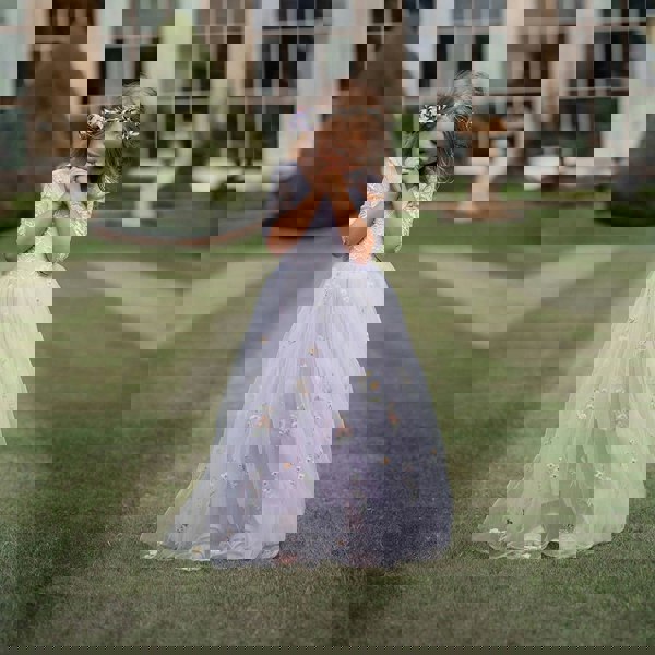 Flower girl wearing the Lilac Enchanted Flower Girl Dress