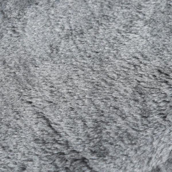 Close-up of light grey plush fabric cover with textured pile