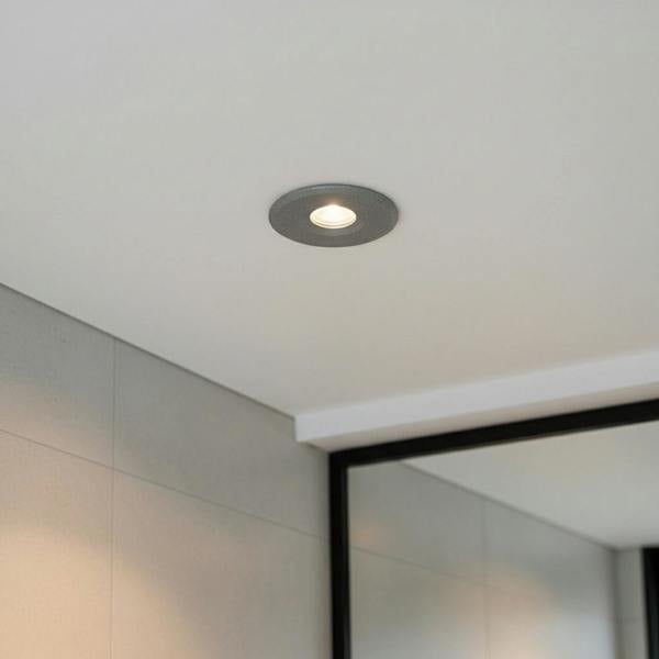 grey small recessed bathroom ceiling light installed in a modern bathroom