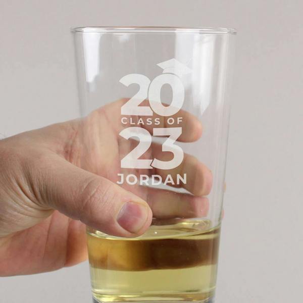 Personalised 'Class Of 'Graduation Pint Glass - product in use
