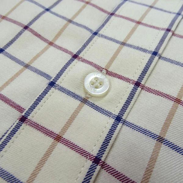 Close-up of Hoggs of Fife Ambassador Tattersall shirt fabric, highlighting fine check pattern, soft cotton texture and stitching detail