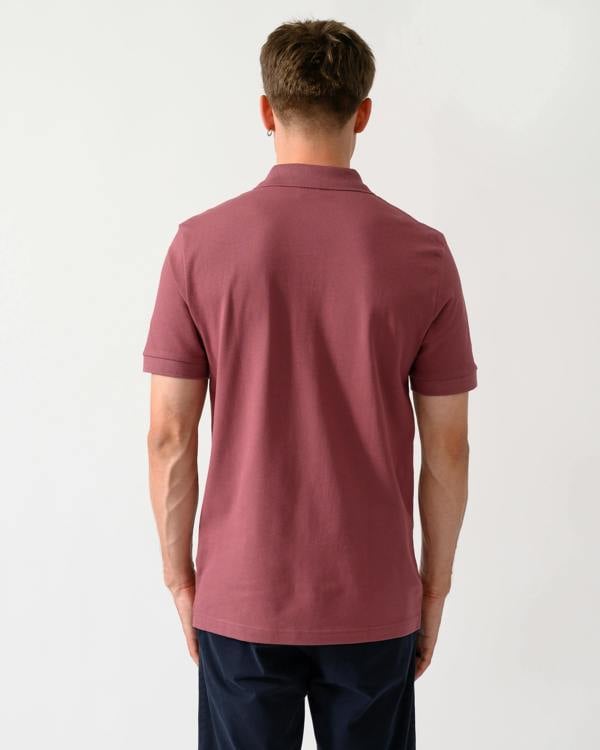 back shot of a model wearing a BOSS Orange Passenger Mens Stretch-Cotton Slim-Fit Polo Shirt with Logo Patch in Medium Red 618