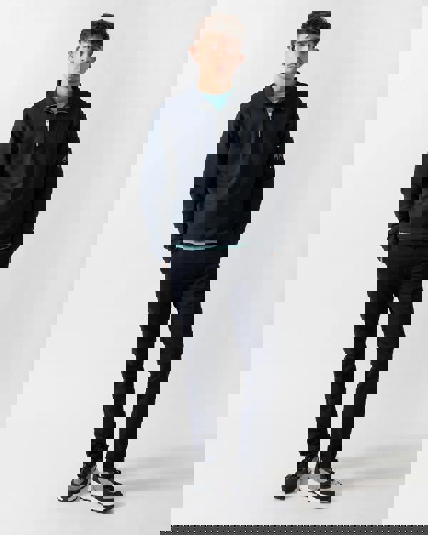 full length shot of a model wearing a Moose Knuckles Hartsfield Mens quarter Zip Sweatshirt in Navy 833