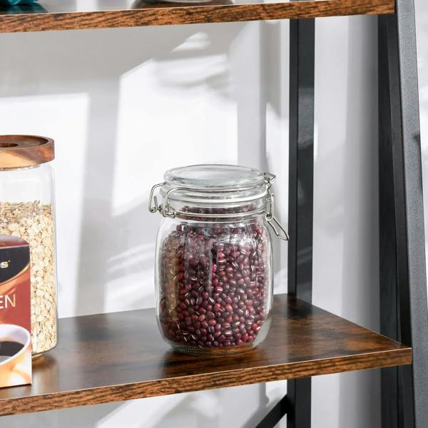 Close-up of brown wood shelf on black metal ladder frame with glass jar storage.