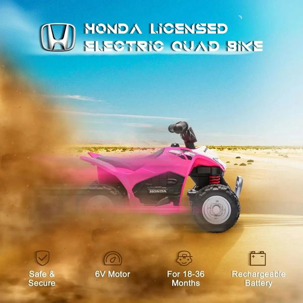 Pink kids Honda electric quad bike in motion with rear suspension and large tires