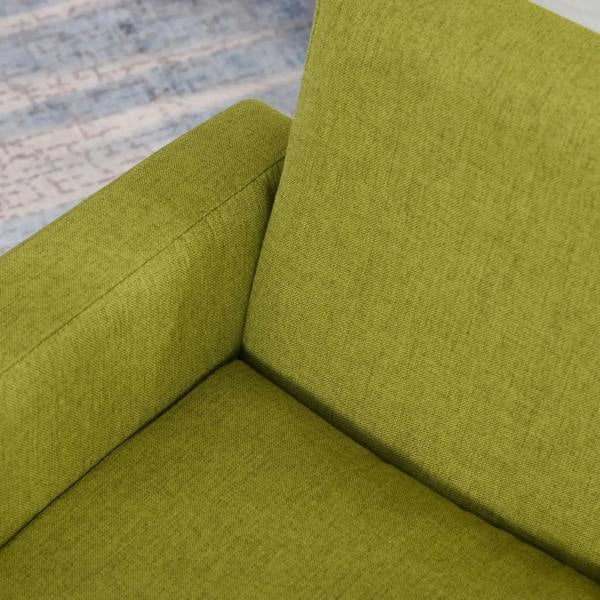 Green upholstered corner of kids armchair with padded seat and back