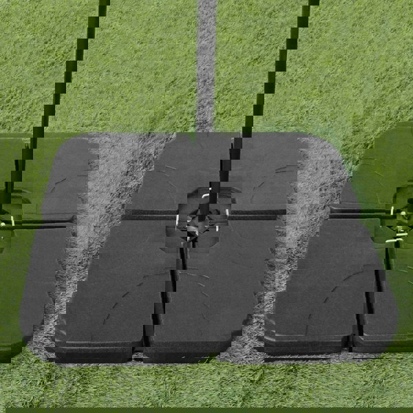 Black cantilever parasol square base with four interlocking sections, designed for stability on grass or patio surfaces