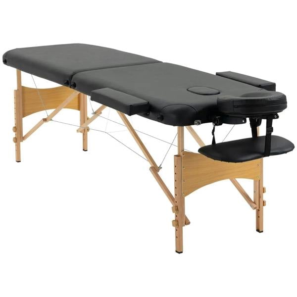 Black folding massage table with two-section padded surface, headrest, and armrest