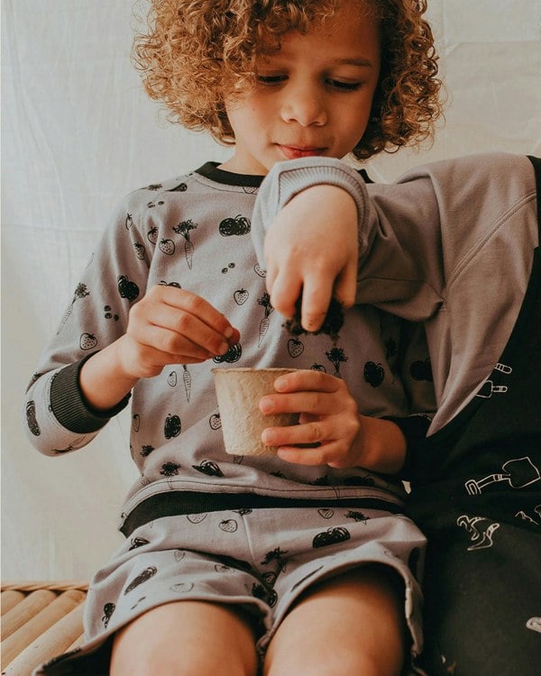 Boy wearing gender-neutral organic cotton kids sweatshirt