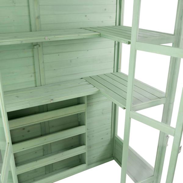 Victorian greenhouse in soft green wood, featuring multiple shelves and a spacious interior for plants and gardening supplies