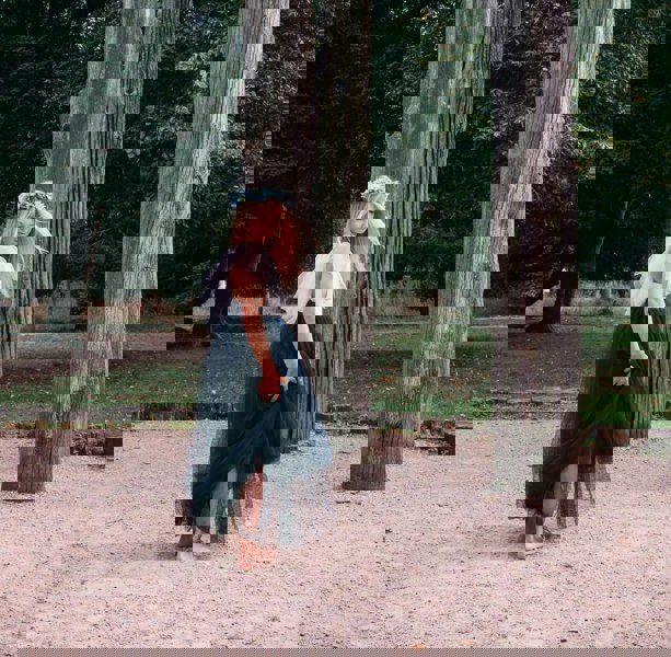 young girl wearing a navy blue flower girl dress