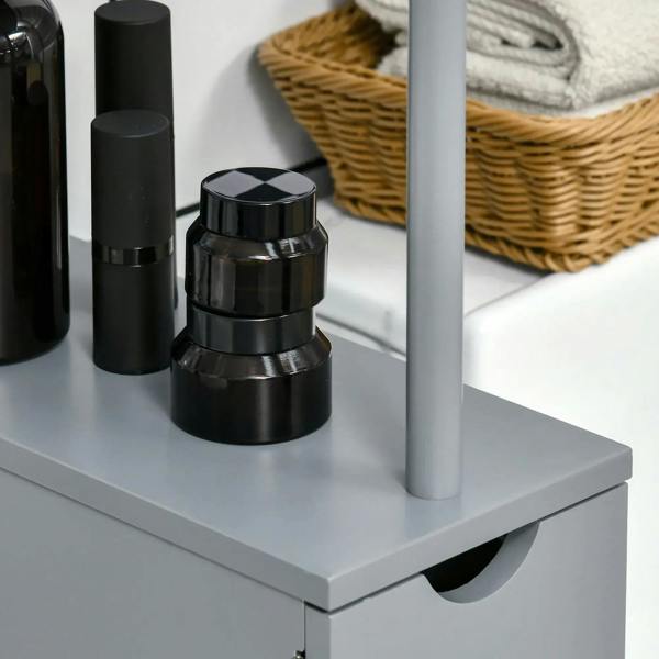 Grey tall cabinet side view with open shelf and drawer fronts beside toiletries.