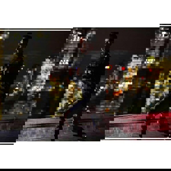 Man gym training at night using Adidas 5kg Dumbbells