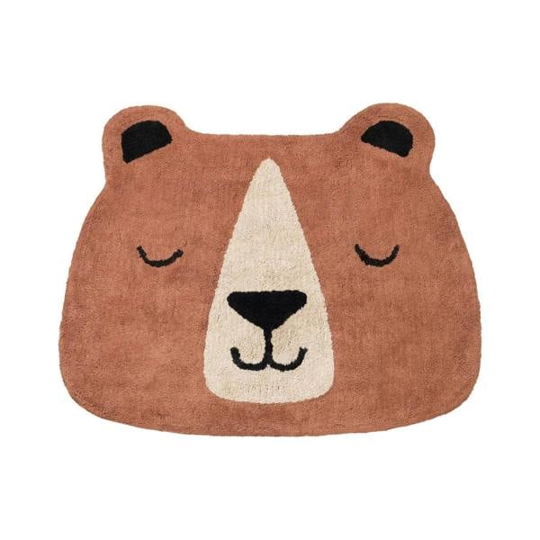 Bear-shaped rug with a smiling face on a white background