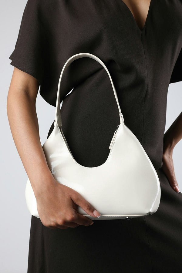 Where's That From Ecru Sleek Minimalist Hobo bag in Cream Patent Faux Leather