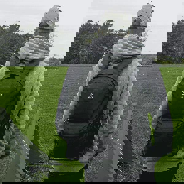 Man wearing an 18L Daysac in black on a field imageset:Black