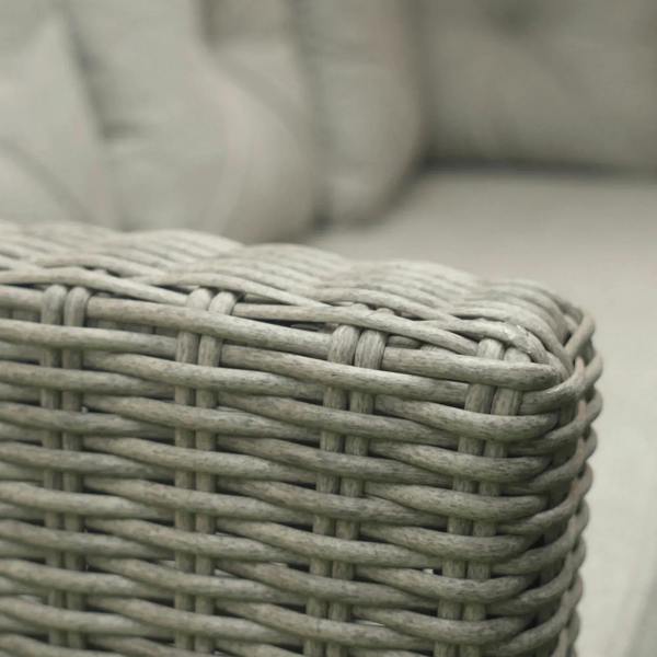 Close-up of grey woven PE rattan wicker texture with rounded edge detail