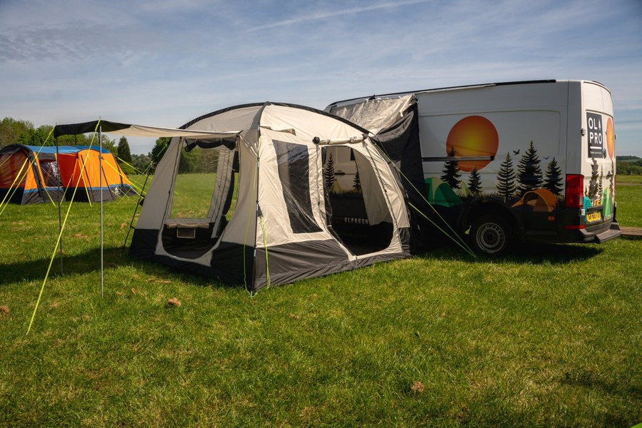 An image of the Cubo XL Motorhome Awning - Fibreglass Poles from OLPRO that is attached to a VW Crafter.