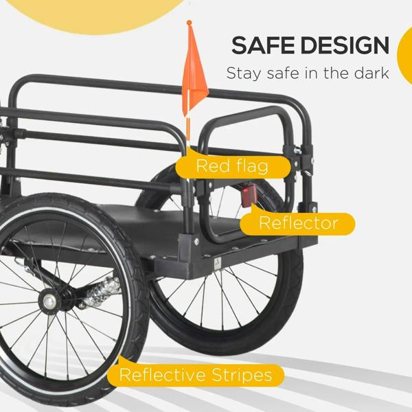 Black bicycle trailer with red flag, reflector, and reflective stripes on wheel guards