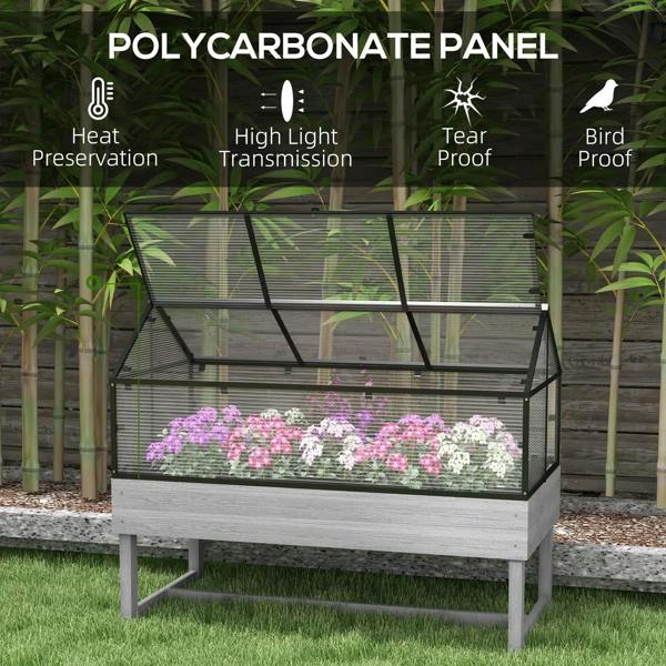 Grey raised garden bed with transparent top panels and mesh frame, raised wooden box