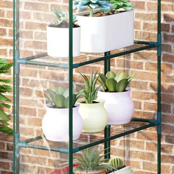 4-tier greenhouse shelving with potted plants inside a clear PVC structure