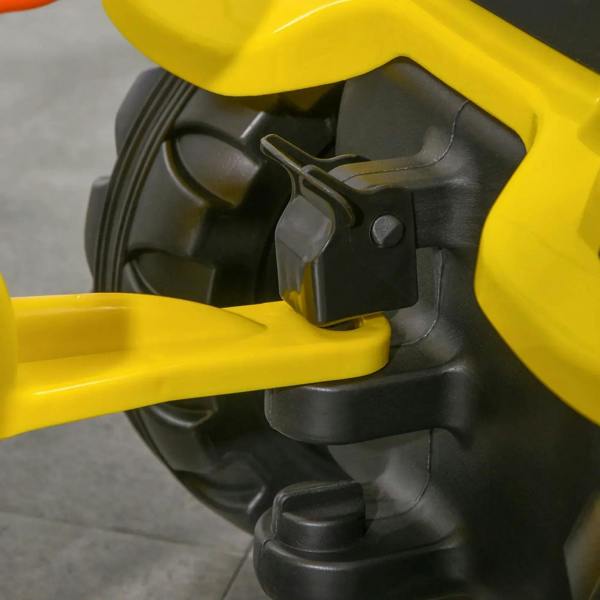 Yellow ride-on tractor seat and control area with black steering column