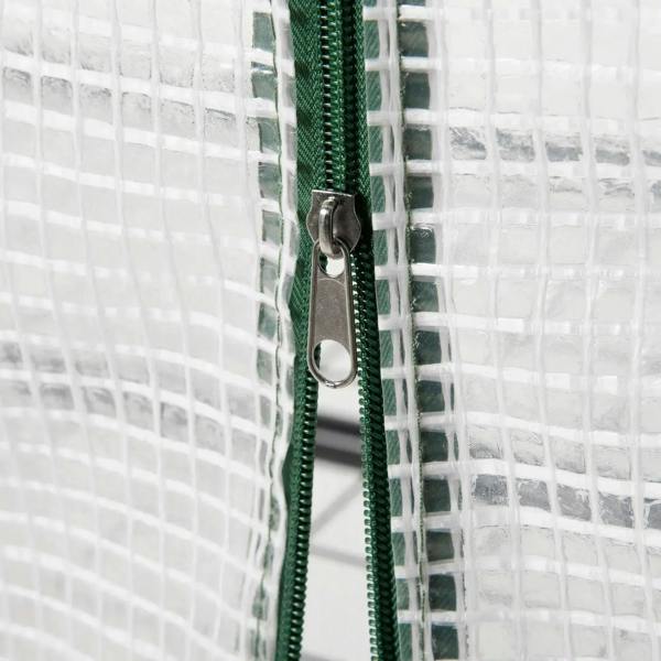 Metal clip with green tie strap securing white PE greenhouse cover
