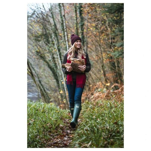 Hoggs of Fife Braemar Pro Wellington Boots in green worn on a woodland walk