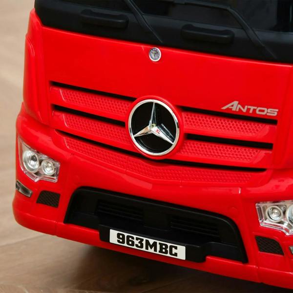 Red ride-on truck front grille with Mercedes-style star emblem and license plate