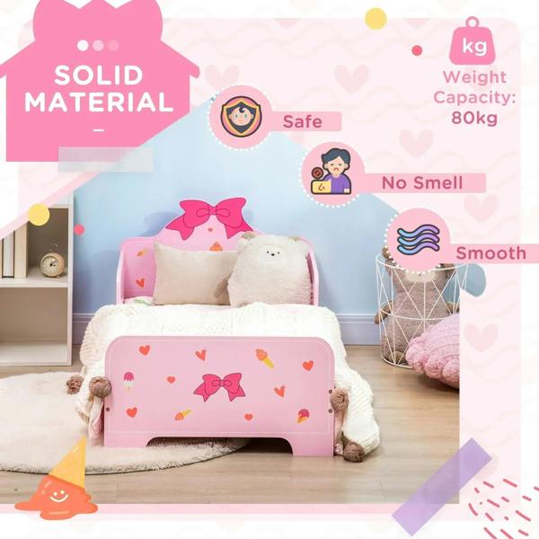 Pink toddler bed with princess bow headboard, heart and ice-cream prints; smooth rails and low front sides