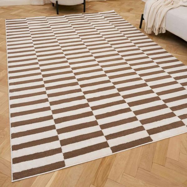Brown and white striped rug on a wooden floor