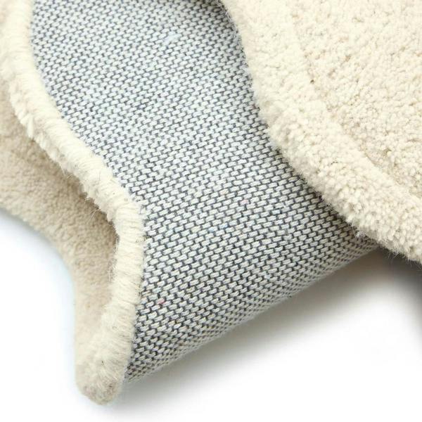 Close-up of a textured blue and beige fabric on a white background