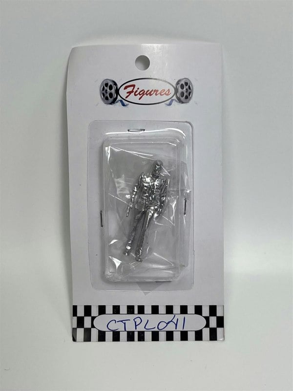 a silver figure in a package