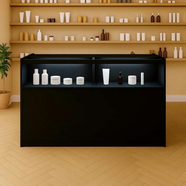 Sleek black LED retail shop counter B1500 with illuminated shelves, displaying various white and brown containers against a warm backdrop