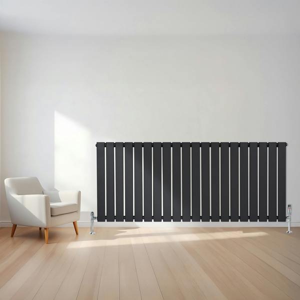 Flat single column radiator in anthracite grey, 600 x 1400mm, featuring vertical slats and sleek design, positioned beside a modern chair