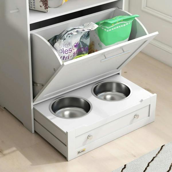 White pet feeder station showing two stainless steel raised bowls and open food drawer.